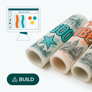 Three rolls of paper with designs and a computer screen showing design.